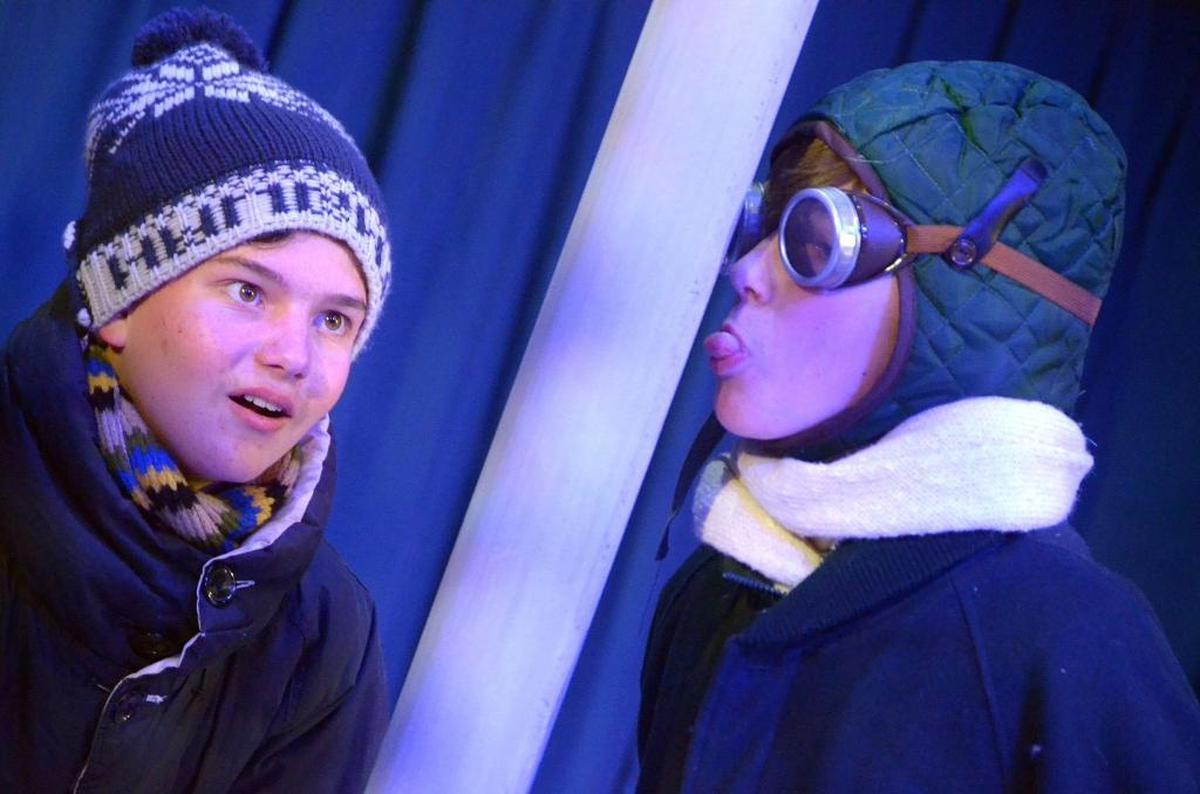 Flick (Evan Clausen) gets his tongue stuck on the flag pole while Schwartz (Drew VanderWeele) looks on in “A Christmas Story,” playing Dec. 2 through 23 at San Luis Obispo Repertory Theatre.