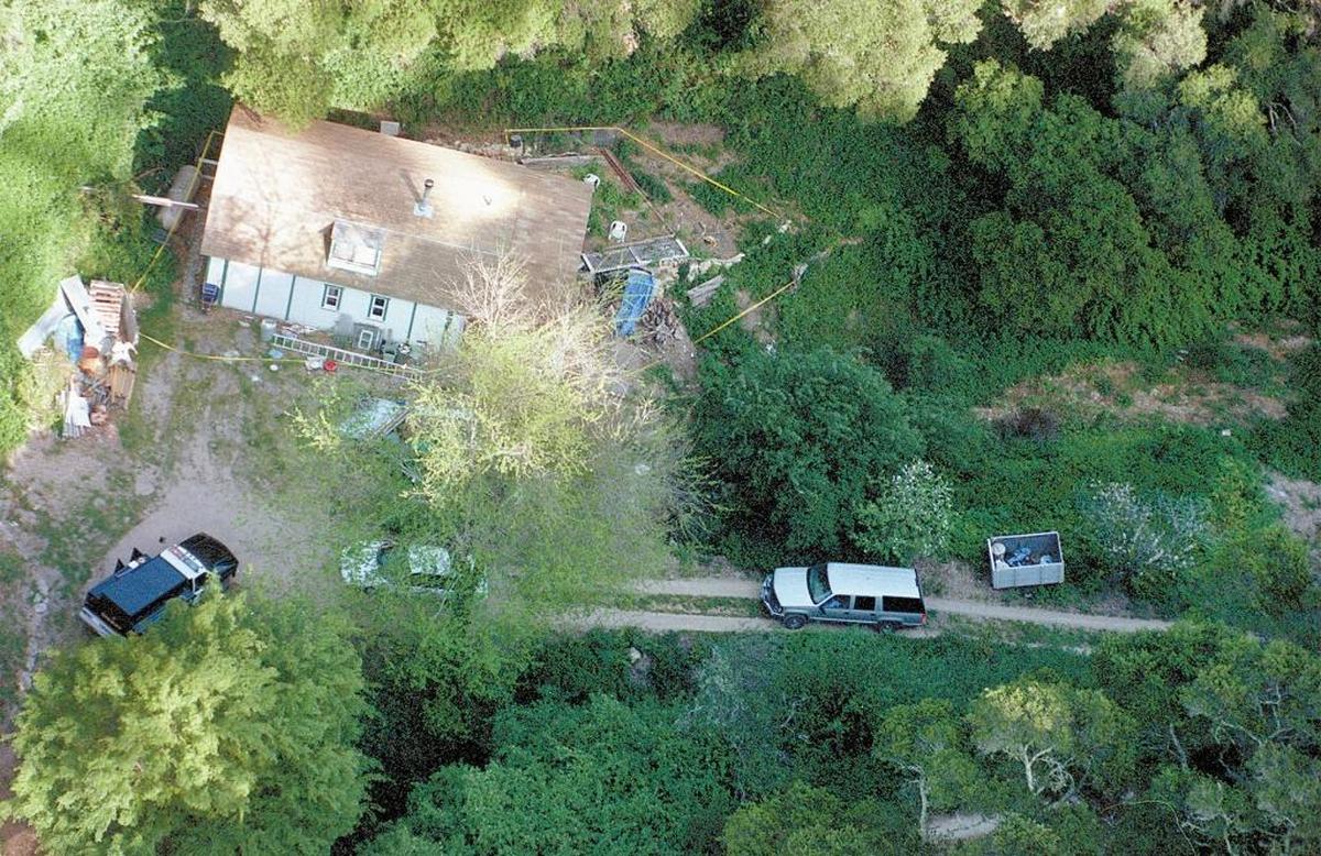 A photograph taken from a helicopter on April 23, 1999, shows police tape surrounding Rex Krebs’ residence in Davis Canyon. Krebs led investigators to the bodies of Rachel Newhouse and Aundria Crawford after confessing to the killings.