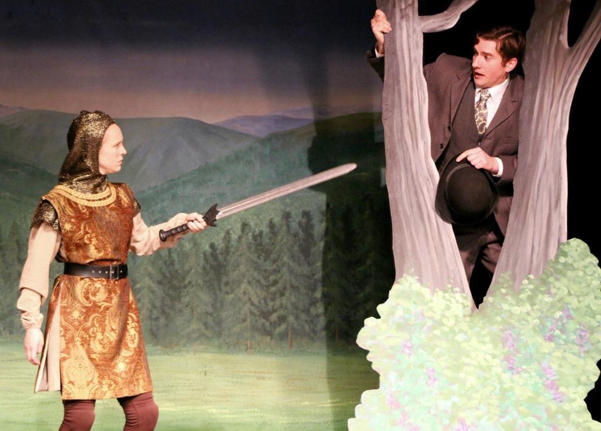 A knight (Molly Wetzel) corners Hank Morgan (Jeffrey Salsbury) in a tree in “A Connecticut Yankee in King Arthur’s Court,” playing at the Great American Melodrama and Vaudeville in Oceano.