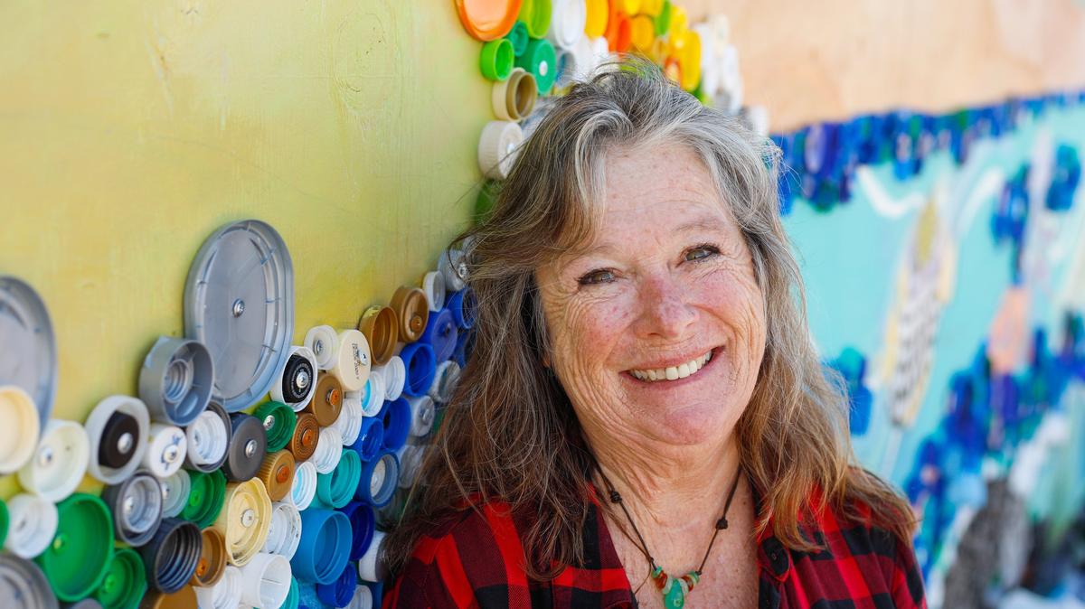Ingrid Goelz, a co-founder of the Cayucos Art Association is working with a new media, recycled plastics. The artist is making a mural on Cayucos skate park wall. David Middlecamp 3-21-2019