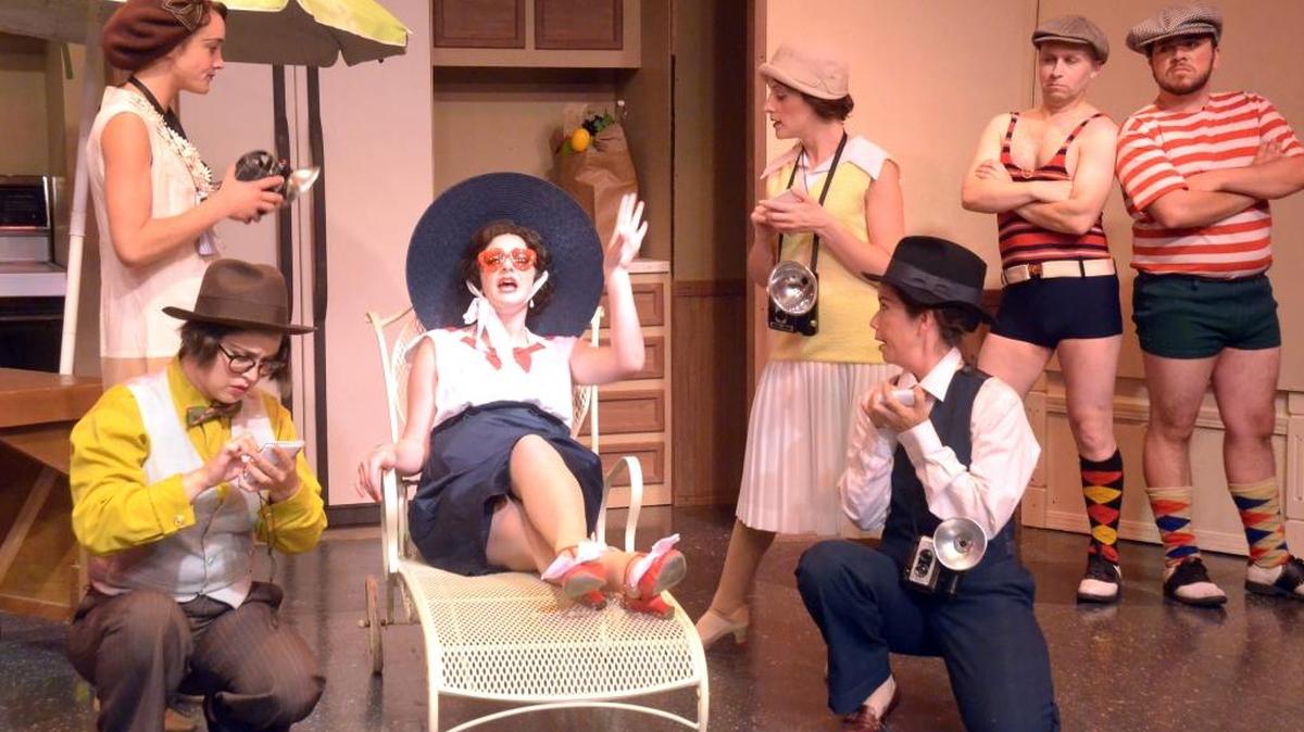 Janet Van De Graaf (Melanie Marie) is surrounded by reporters (Amanda Thayer, Erin Parsons, Naomi Skee and Natalia Salsbury) while two gangsters (Darrell Haynes and Vincent Lemos) look on in “The Drowsy Chaperone,” playing at San Luis Obispo Little Theatre.