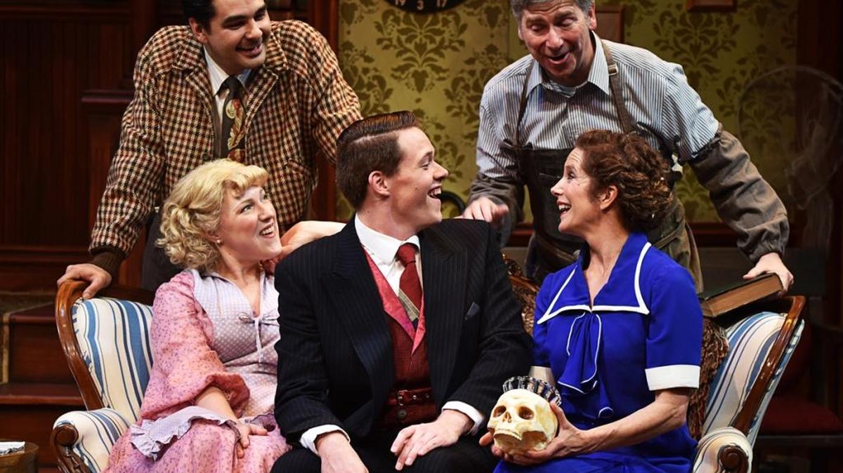 Tony Kirby (Chad Sommerville), seated at center, gets a once-over from, clockwise from top left, Ed Carmichael (George Walker), Paul Sycamore (Don Stewart), Essie (Karin Hendricks) and Penelope Sycamore (Polly Firestone Walker) in PCPA-Pacific Conservatory Theatre’s production of “You Can’t Take It With You.”
