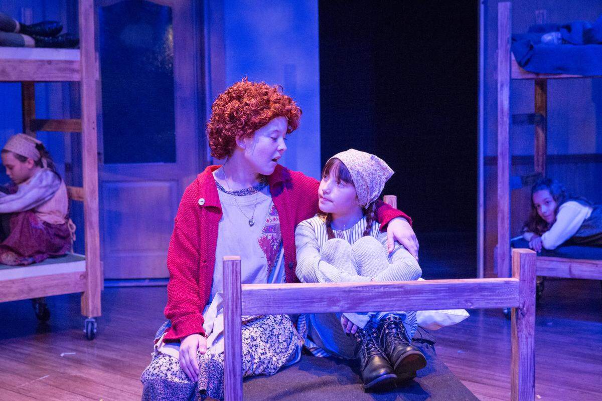 Annie (Liana Lindsey) sings to a fellow orphan in a scene from "Annie," playing through July 1 at San Luis Obispo Repertory Theatre in San Luis Obispo.