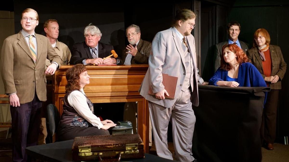 Justin Wessell, Tim Linzey, Joyce Calderone, Craig Brooke, Don Dallmann, Rick Bruce, Libby Parker, Randall C. Lyon and Janice Peters appear in a scene from ‘Nuts,’ playing at Pewter Plough Playhouse in Cambria.