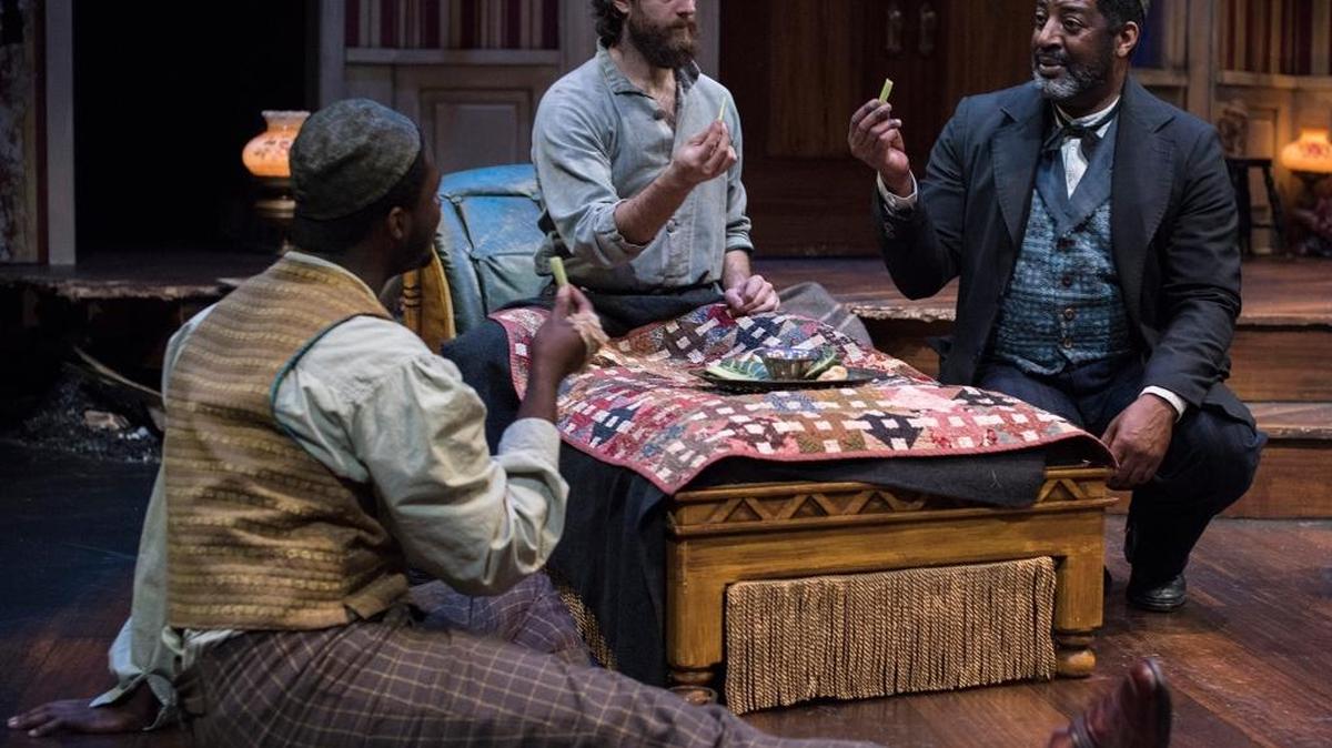 John (Antwon D. Mason Jr.), Caleb (Matt Koenig) and Simon (Derrick Lee Weeden) celebrate Passover in a scene from PCPA-Pacific Conservatory Theatre’s production of “The Whipping Man.”