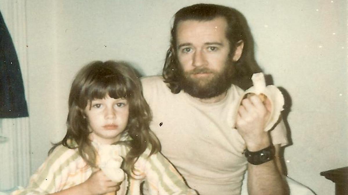 Kelly Carlin and her father, George Carlin, eat bananas in this family photo