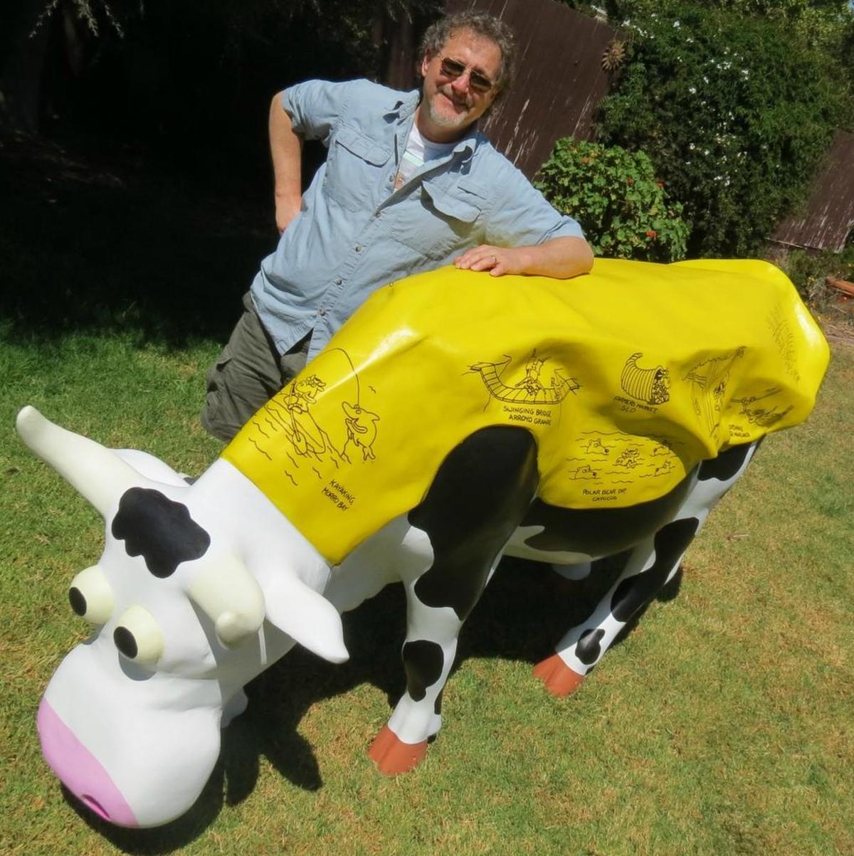 Leigh Rubin poses with “Adventure Cow,” one of the cow sculptures featured in the public art exhibition CowParade San Luis Obispo County.