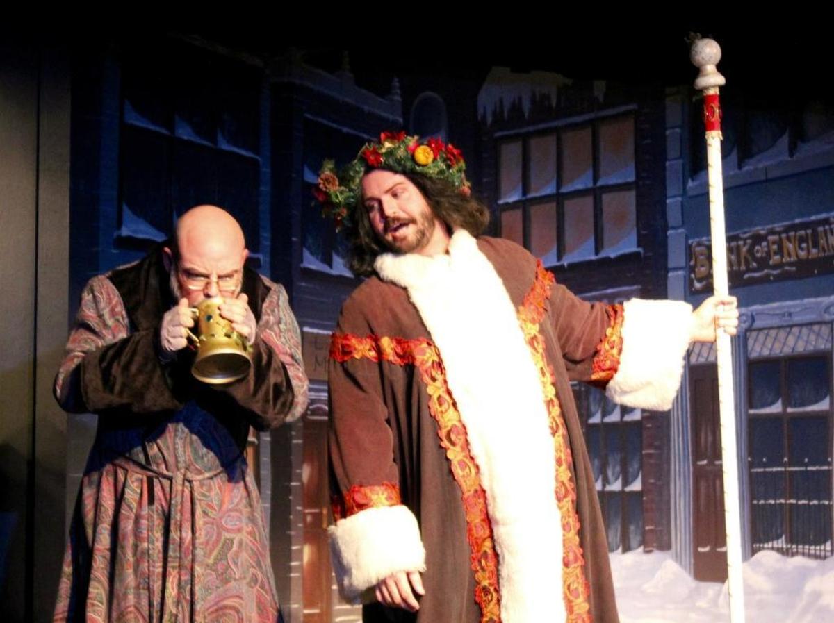 Ebenezer Scrooge (Beau Heckman) is visited by the Ghost of Christmas Present in “A Christmas Carol,” part of “The Holiday Extravaganza” playing Thursday through Dec. 31 at the Great American Melodrama in Oceano.