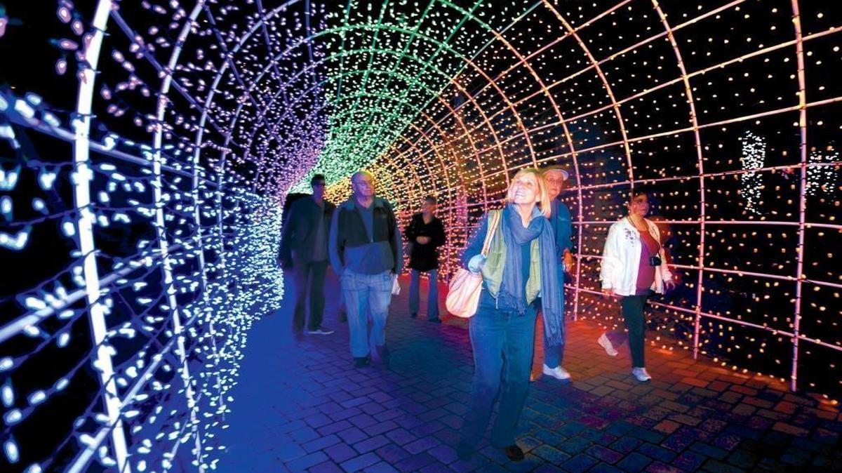 Donna Hoppe of Cambria gazes up at the lighted tunnel which greets visitors to the Cambria Christmas Market, running Nov. 24 through Dec. 23.