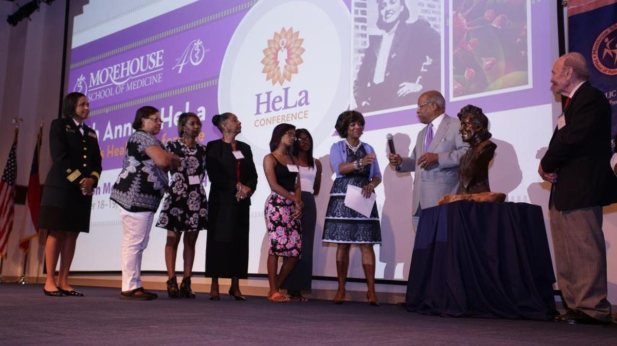 The descendants of Henrietta Lacks join Rear Adm. Sylvia Trent-Adams, Morehouse School of Medicine President and Dean Valerie Montgomery Rice, Morehouse President Emeritus Louis W. Sullivan and medical researcher Roland Patillo to unveil a bust in honor of Lacks at the school’s 20th annual women’s conference in her honor.