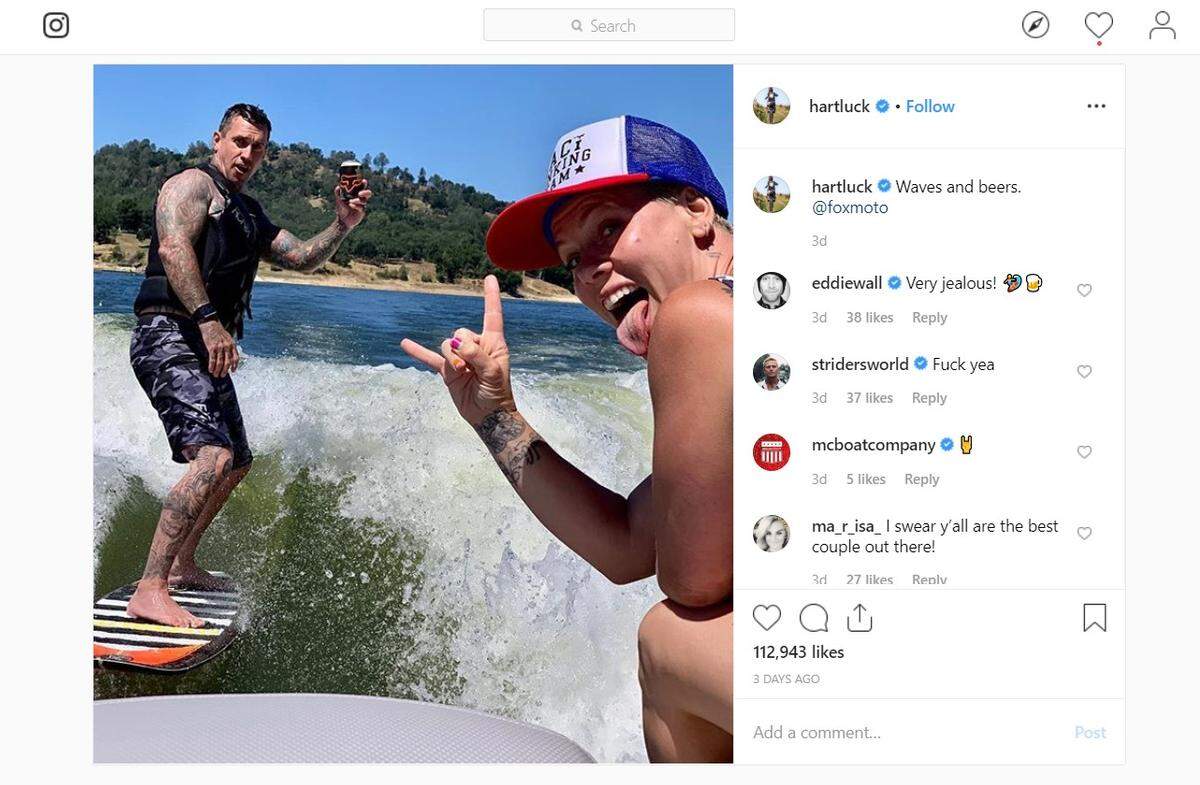 Retired motocross racer Carey Hart, left, and his wife, pop star Pink, pose for a photo at Lake Nacimiento north of Paso Robles, California, on Saturday, June 8, 2019.