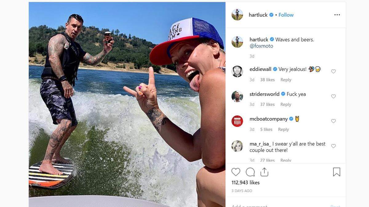 Retired motocross racer Carey Hart, left, and his wife, pop star Pink, pose for a photo at Lake Nacimiento north of Paso Robles, California, on Saturday, June 8, 2019.