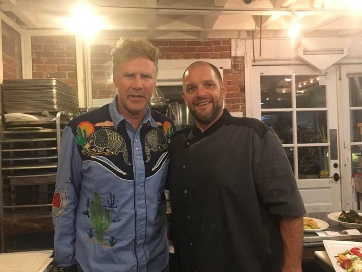 Actor Will Ferrell poses for a photo with Thomas Hill Organics’ sous chef, Marcos, in Paso Robles in October 2017.