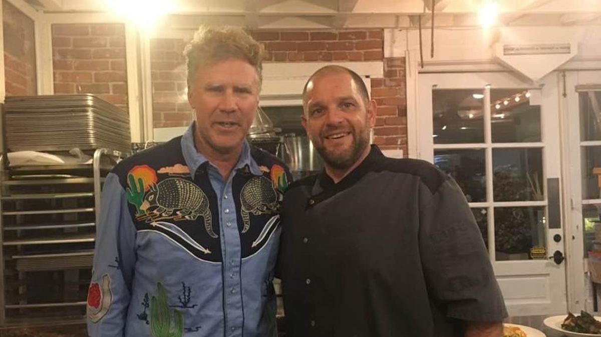 Actor Will Ferrell poses for a photo with Thomas Hill Organics’ sous chef, Marcos, in Paso Robles in October 2017.