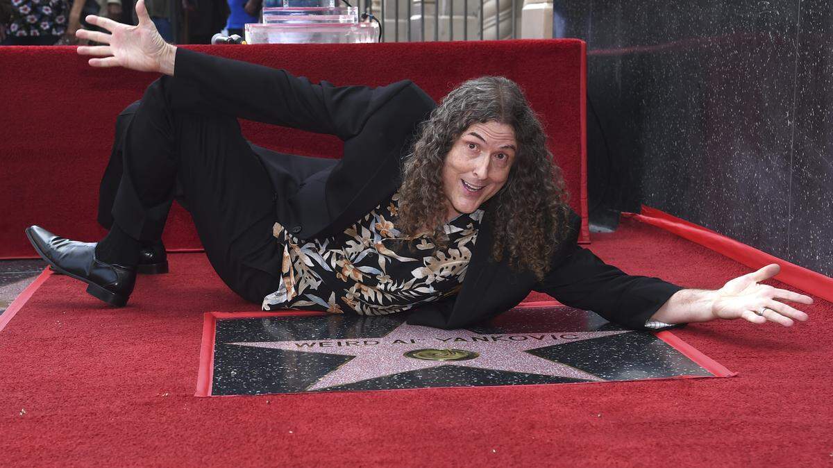 Musician/comedian “Weird Al” Yankovic, known for song parodies including “Eat It” and “Like A Surgeon,” poses atop his star on the Hollywood Walk of Fame following a ceremony in his honor on Monday, Aug. 27, 2018, in Los Angeles. (Photo by Richard Shotwell/Invision/AP)