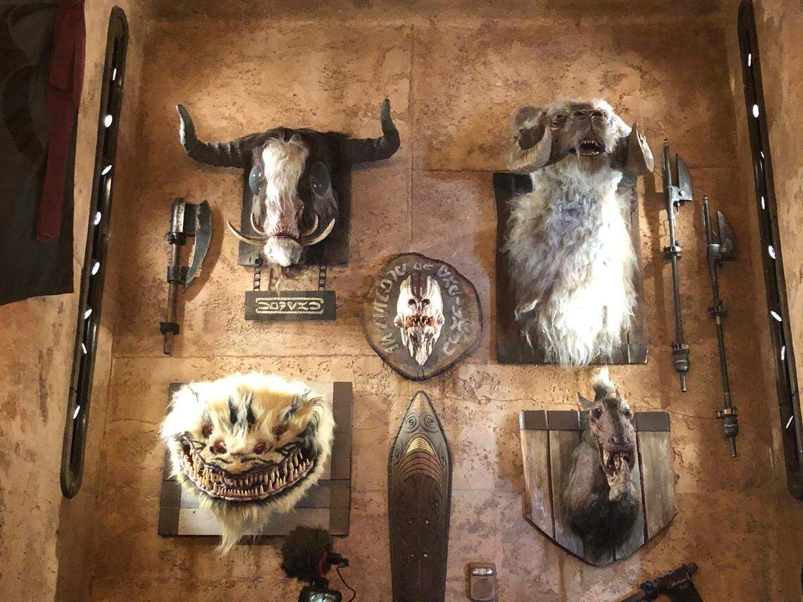 Heads of animals appear on the walls of Dok-Ondar’s Den of Antiquities at Disneyland’s Star Wars: Galaxy’s Edge, where visitors can buy Jedi and Sith artifacts. The new “Star Wars”-themed theme park attraction opens on Friday, May 31, 2019, in Anaheim, California.