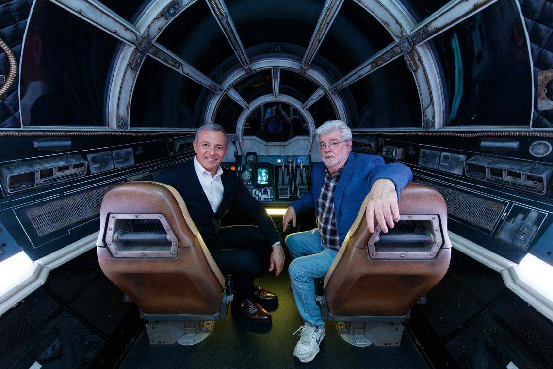 Bob Iger, Walt Disney Company chairman and CEO, and George Lucas,&nbsp;”Star Wars”&nbsp;creator, pose inside Millennium Falcon: Smugglers Run at Star Wars: Galaxy’s Edge at Disneyland Park in Anaheim, California, on Wednesday, May 29, 2019.&nbsp;Star Wars: Galaxy’s Edge&nbsp;opens to the general public on Monday, June 24, 2019, at Disneyland Resort in California.