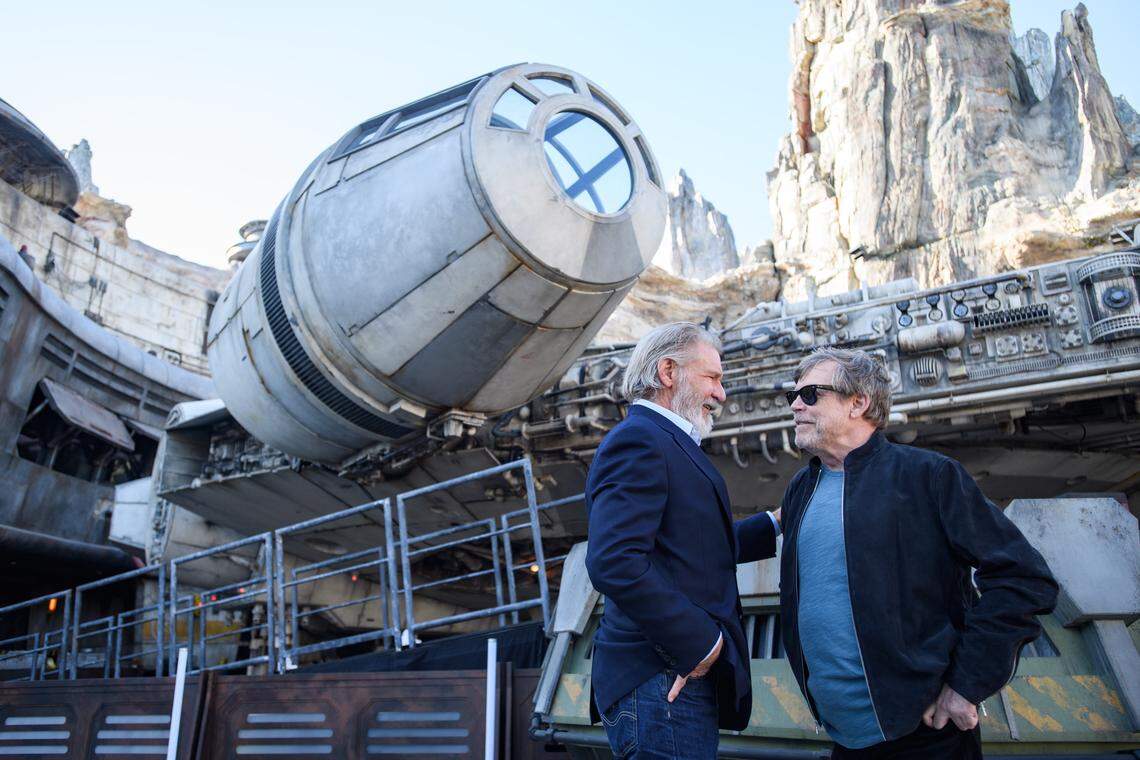 Actors Harrison Ford, and  Mark Hamill pose in front of the Millennium Falcon at Star Wars: Galaxy’s Edge at Disneyland Park in Anaheim, California, on Wednesday, May 29, 2019.&nbsp;Star Wars: Galaxy’s Edge&nbsp;opens on Friday, May 31, 2019, at Disneyland Resort in California and Aug. 29, 2019, at Walt Disney World Resort in Florida.