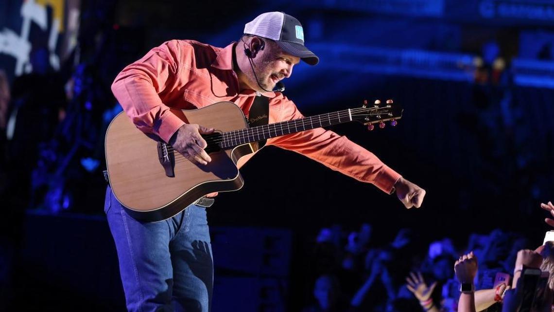 Garth Brooks gives a fist bump to a fan during his performance at the 2017 CMA Music Festival in Nashville, Tennessee. The country superstar will play two sold-out concerts on July 27 at the California Mid-State Fair in Paso Robles.