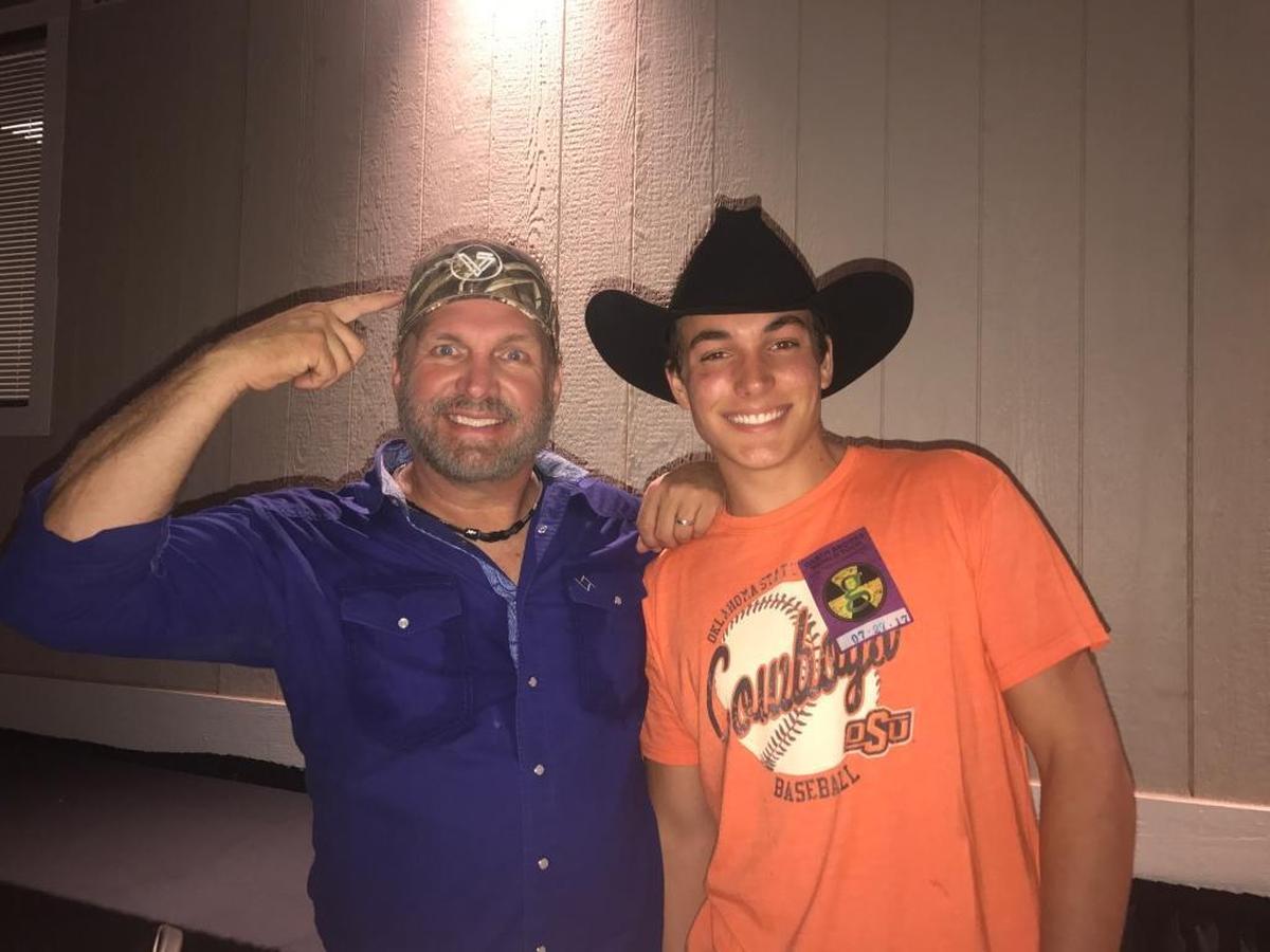Arroyo Grande High School graduate Jack Ventura, right, poses for a photo with country star Garth Brooks at the California Mid-State Fair in Paso Robles on July 27, 2017. Brooks wears a hat sporting the words “17 Strong,” the name of the nonprofit started by late Arroyo Grande High grad Ryan Texeira.