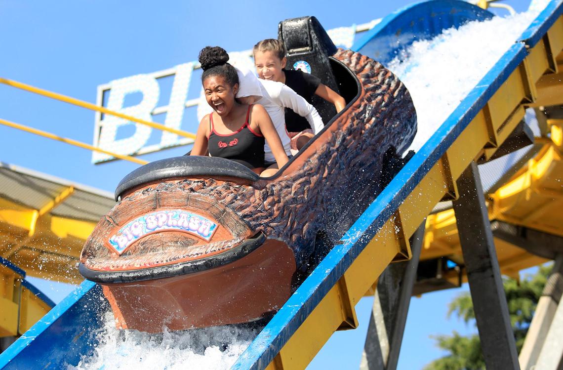 Fairgoers enjoy free carnival rides on opening day of the California Mid-State Fair, Wednesday, July 17, 2019. Mutale Malama, 14, front, Ava Buschur, 15, hidden, and Olivia Buschur, 13, rear, all of San Luis Obispo, scream as they fly down the Big Splash log ride.