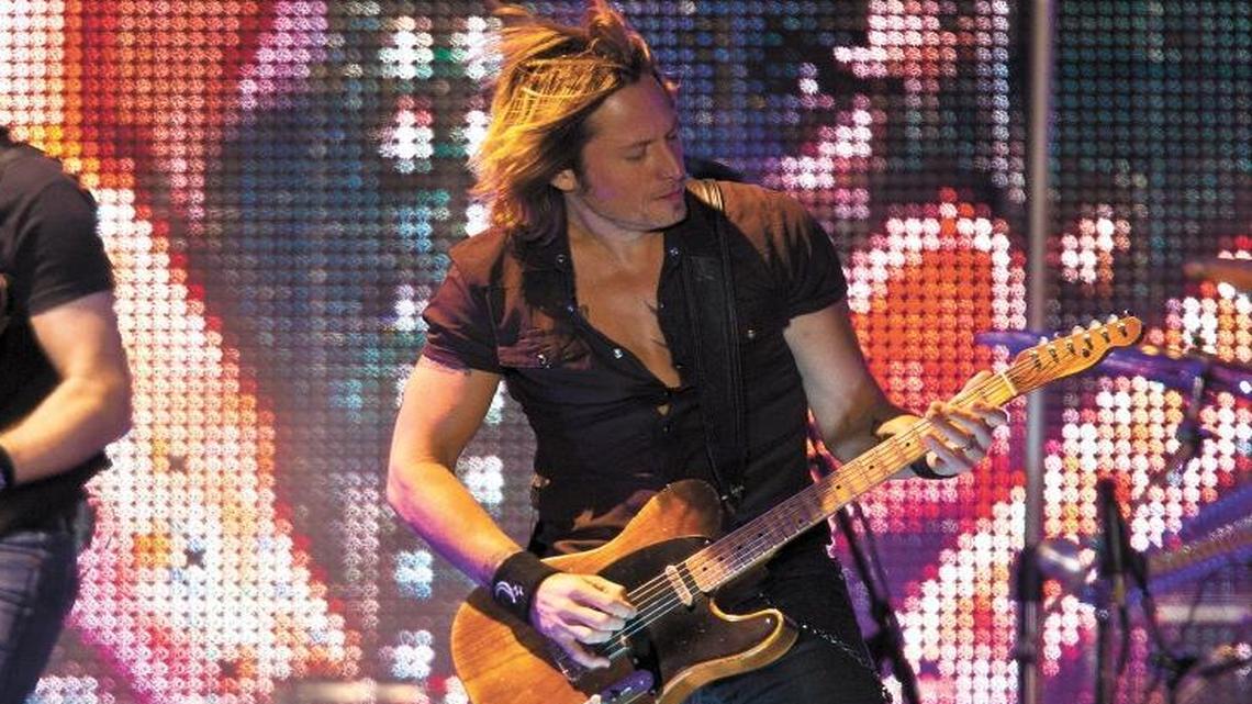 Keith Urban, right, performs at the California Mid-State Fair in Paso Robles in 2010. The country star will return to the Paso Robles Event Center on July 24, 2025.