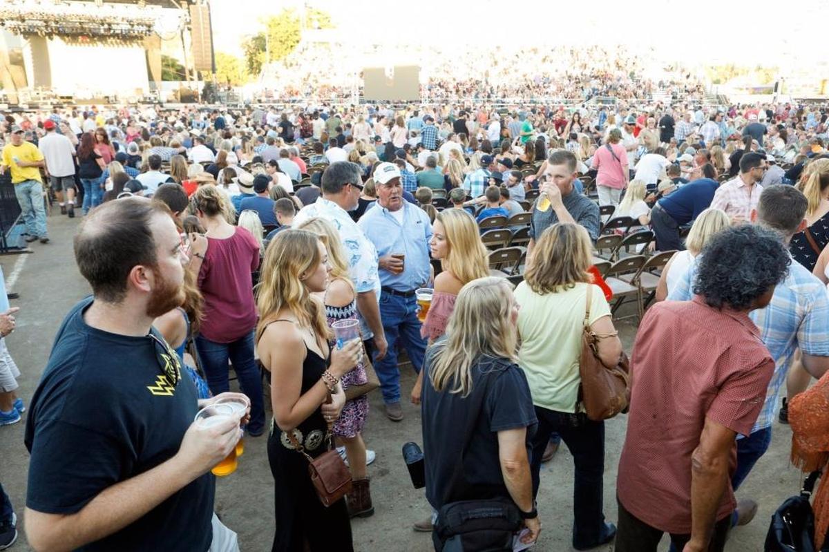 Fans flock into the Chumash Grandstand Arena on Thursday, July 27, 2017, for the first of two Garth Brooks concerts at the California Mid-State Fair in Paso Robles.