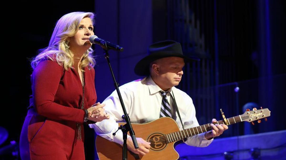 From left, Trisha Yearwood and Garth Brooks perform at the Country Music Hall of Fame and Museum in 2015 in Nashville, Tennessee. They will perform July 27 at the California Mid-State Fair in Paso Robles.