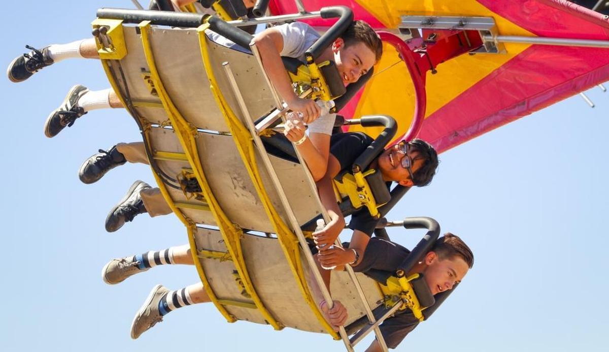 Fairgoers ride the Cliff Hanger at the California Mid-State Fair in Paso Robles.