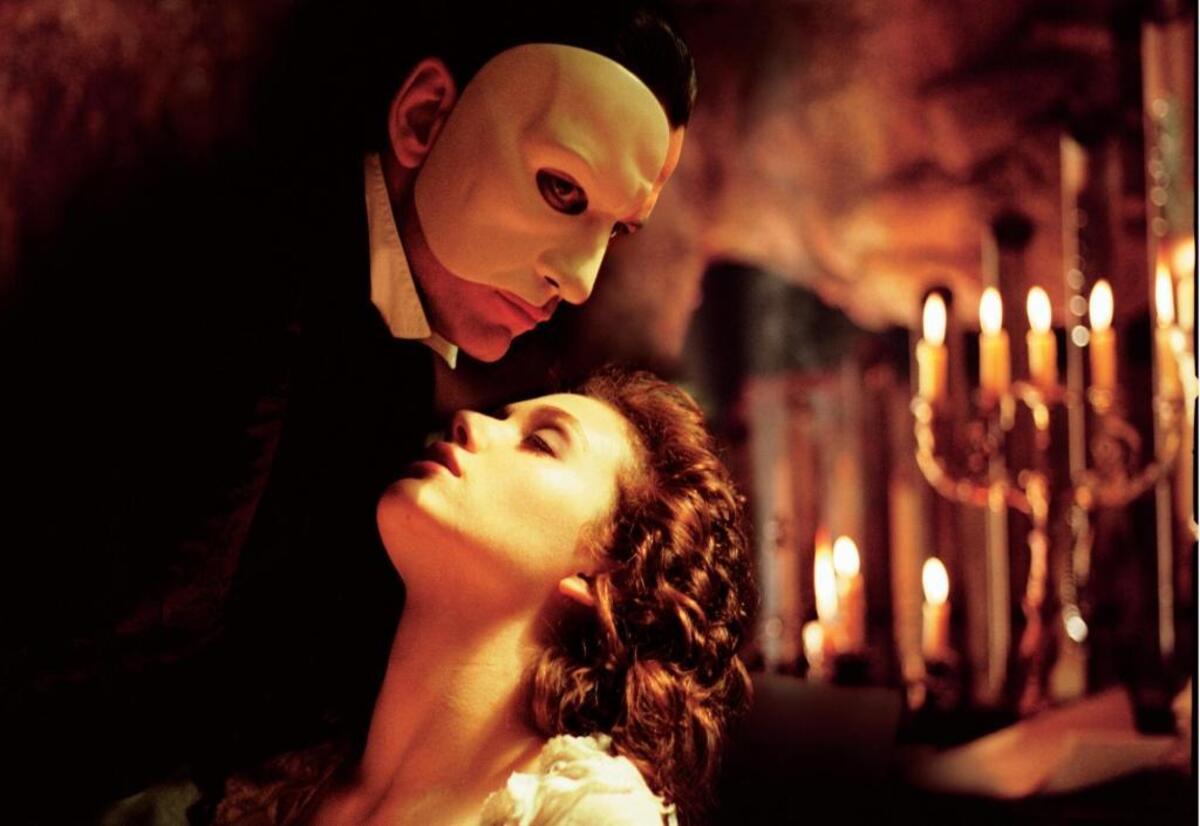 The Phantom (Gerard Butler) and Christine (Emmy Rossum) appear in a scene from 2004’s “The Phantom of the Opera.” The 1925 silent film of the same title screens Oct. 26 in San Luis Obispo.