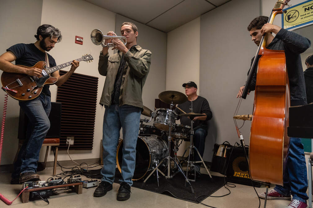IATA band members Adam Nash, Tyler Dukes, and Ian Skinner rehearse with drummer Dean Giles, sitting in for Alex Nash, at Cuesta College in San Luis Obispo.