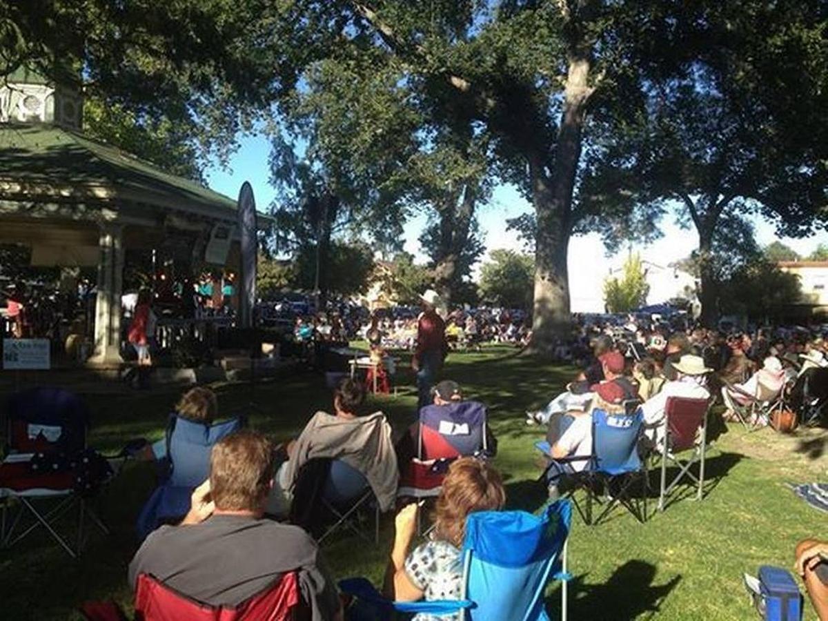 Attendees watch a band play during Concerts in the Park in Paso Robles.