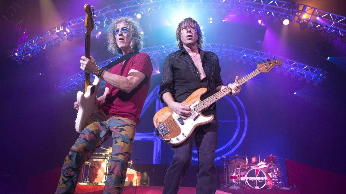 Bruce Watson, left, and Jeff Pilson of the band Foreigner perform in concert during their “40th Anniversary Tour” at the BB&T Pavilion on Thursday, July 13, 2017, in Camden, N.J.