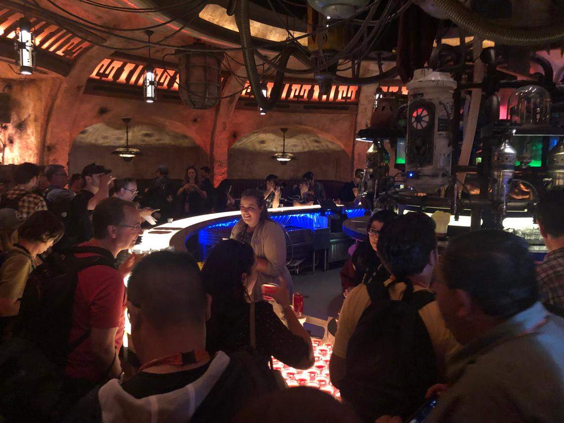 Inside Oga’s Cantina at Disneyland’s Star Wars: Galaxy’s Edge, you can sip alcoholic or non-alcoholic concoctions while you take in the scum of the galaxy, make covert deals or just enjoy the tunes of Rex, the Star Tours pilot turned DJ. The new “Star Wars”-themed land opens Friday at the Anaheim, California, theme park.