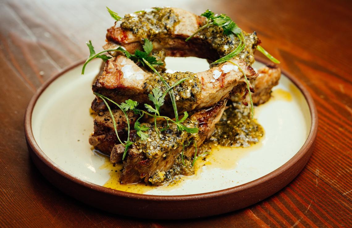 Tuscan-style pork ribs are served with charred tomatillo salsa at the Cass House Grill in Cayucos.