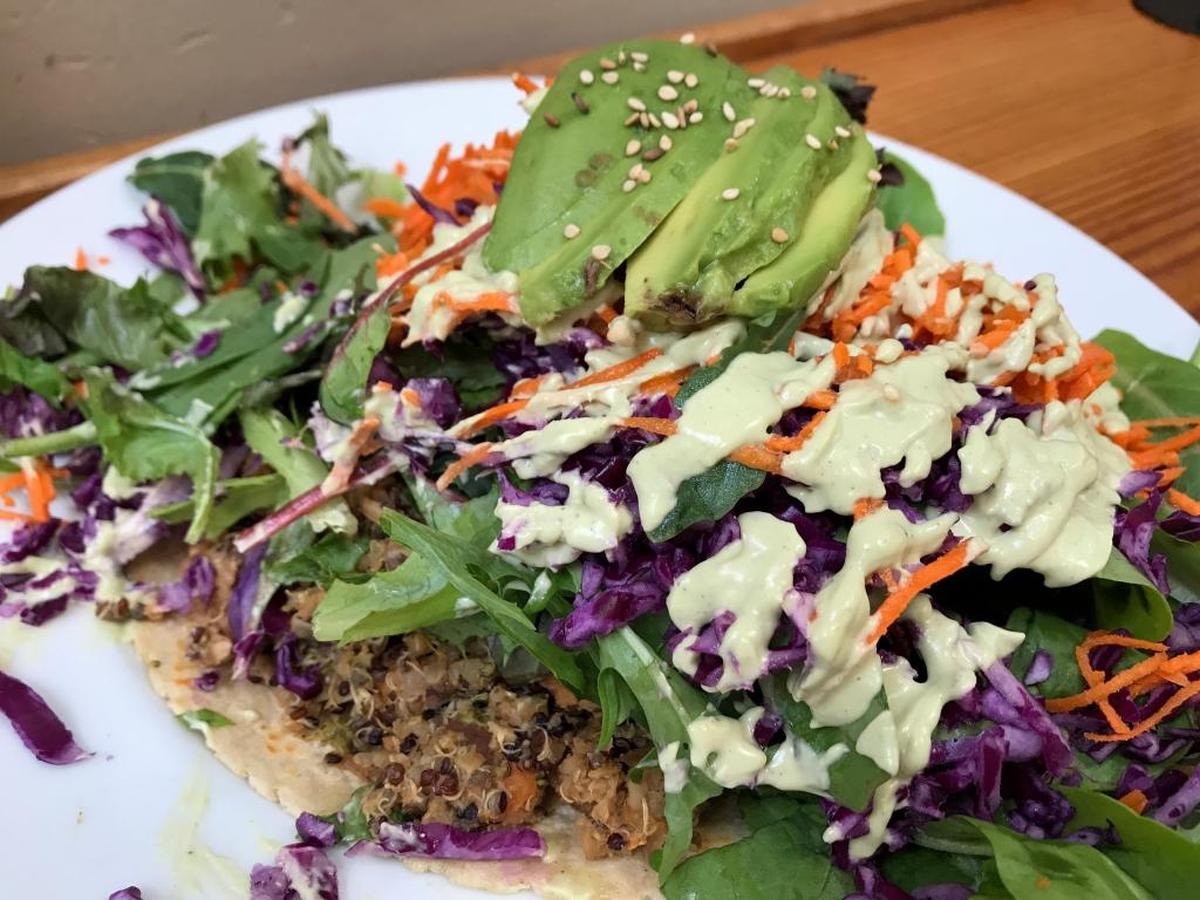 The tempeh taco at Shine Cafe in Morro Bay features tempeh, quinoa, spring mix, fresh veggies, avocado and sesame seeds on a wheat and corn tortilla.