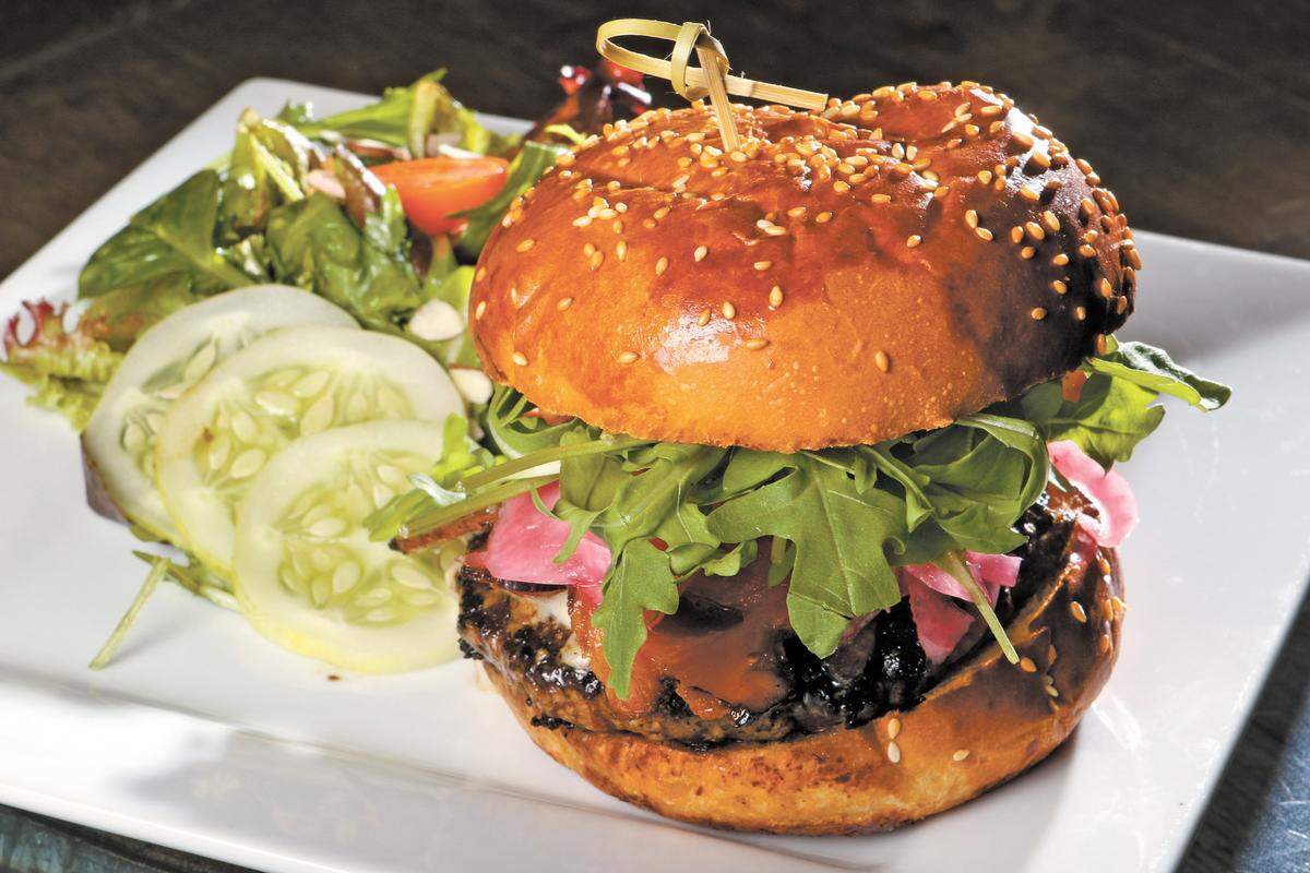 The Bennie’s Burger is made with local beef and served with house-cured bacon, blue cheese, horseradish aioli, pickled onions and arugula at The Cafe at Cass Vineyard & Winery in Paso Robles.