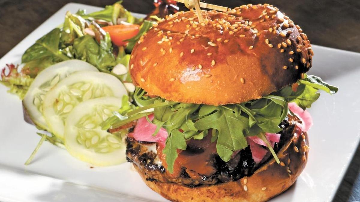 Benny’s Burger, local beef with house-cured bacon, blue cheese, horseradish aioli, house pickled onions and arugula from Cass Winery outside Paso Robles.