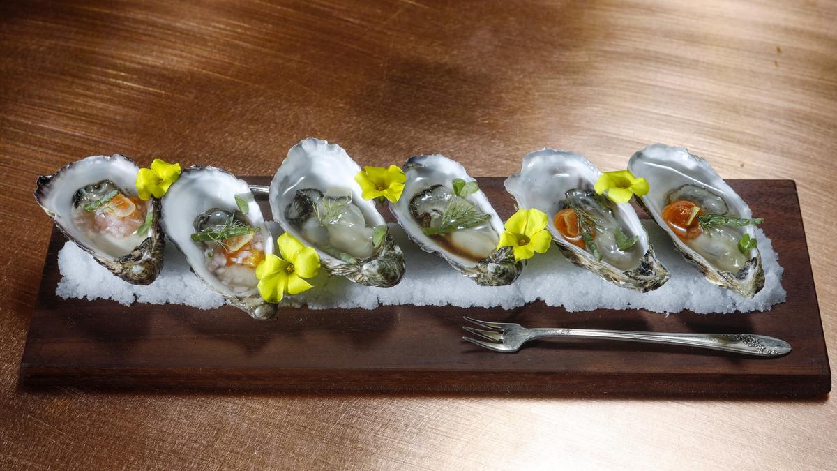 Grassy Bar oysters are served with a citrus mignonette, pepper-horseradish sauce, soy citrus ponzu and sea beans at Blue Heron in Baywood Park.