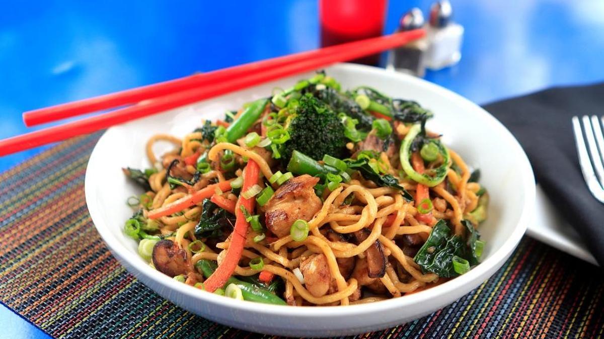 The popular lo mein stirfry at Novo Restaurant and Lounge in San Luis Obispo features sauteed kale, fresh wheat noodles, vegetables, garlic, ginger, soy sauce and sesame oil.