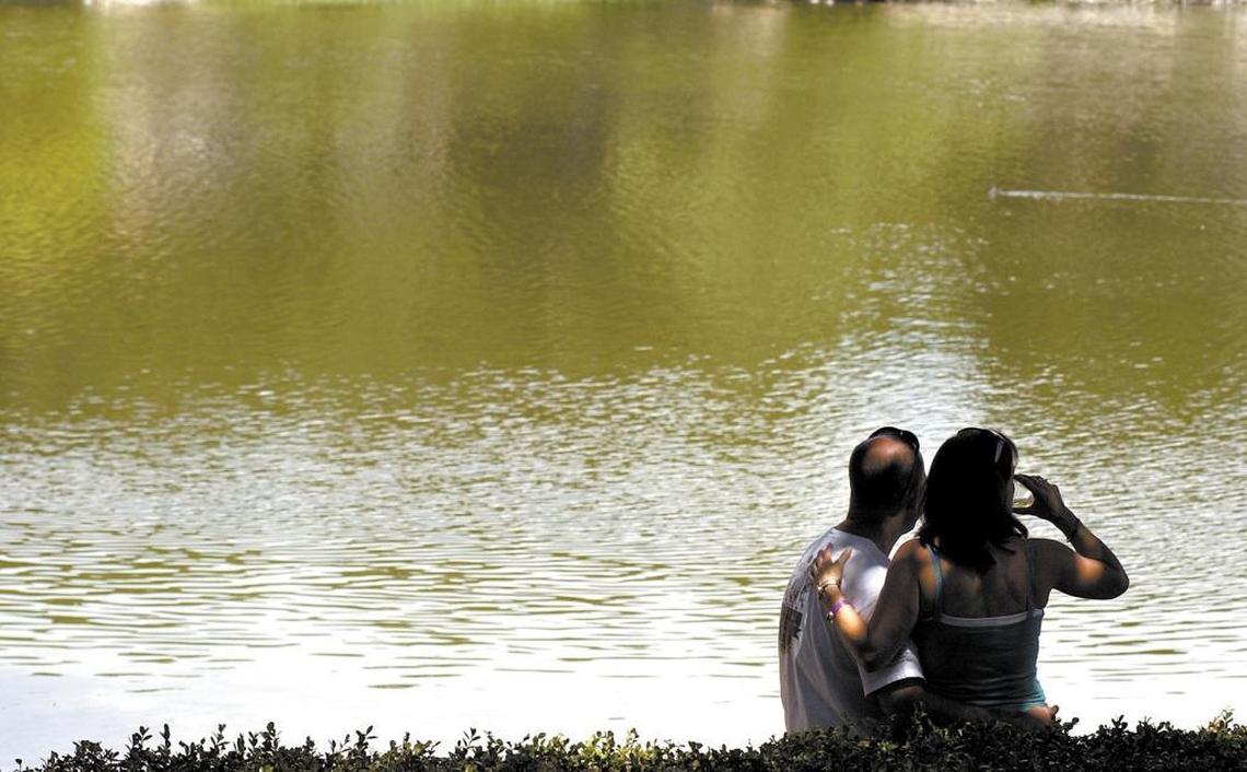 Melissa and Mike Froehner of Atascadero sit by Atascadero Lake at the Atascadero Lakeside Wine Festival in 2006. The festival returns in June 2017.