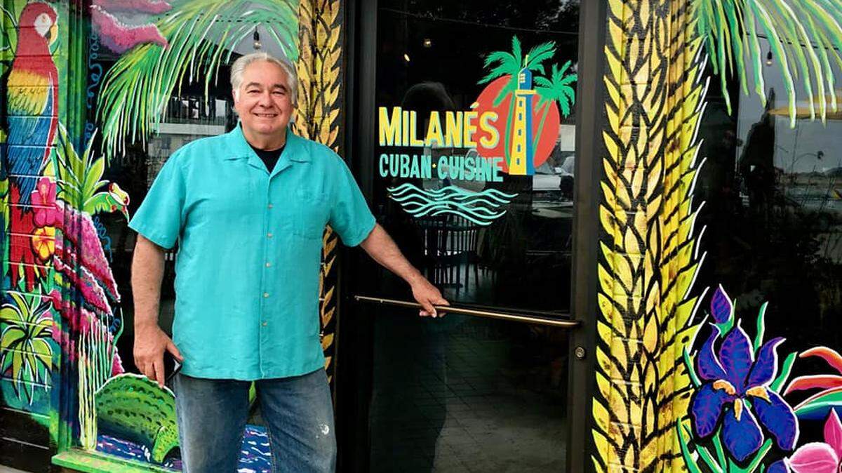 Restaurant owner Jorge Milanes poses for a photo in front of Milanes Cuban Cafe in Morro Bay.