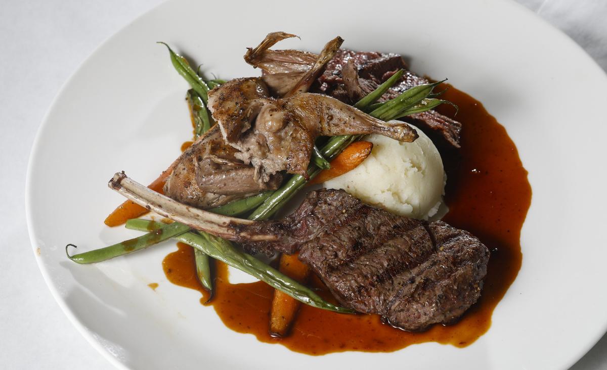 A mixed grill entrée at Park Street Grill, formerly Farmstead Kitchen & Catering, in Paso Robles features venison rack-chop, baby quail and bison strip loin.
