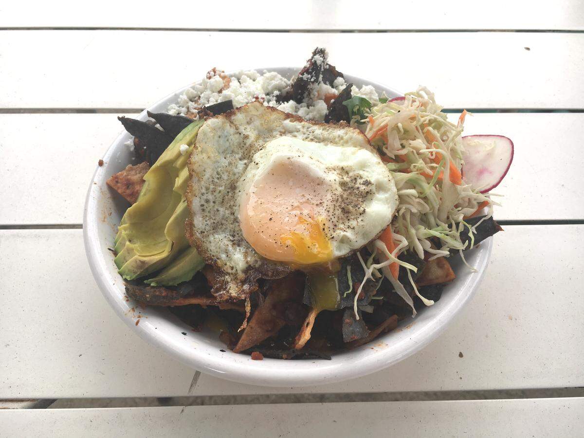 At Kitchenette in Templeton, chilaquiles come with housemade soy chorizo, black beans, feta cheese, avocado and a fried egg.