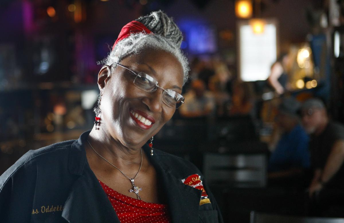 Miss Oddette’s Creole Kitchen owner Oddette Augustus serves pulled pork and coleslaw sandwiches at the weekly blues jam held at D’Anbino Vineyards & Cellars in Paso Robles.