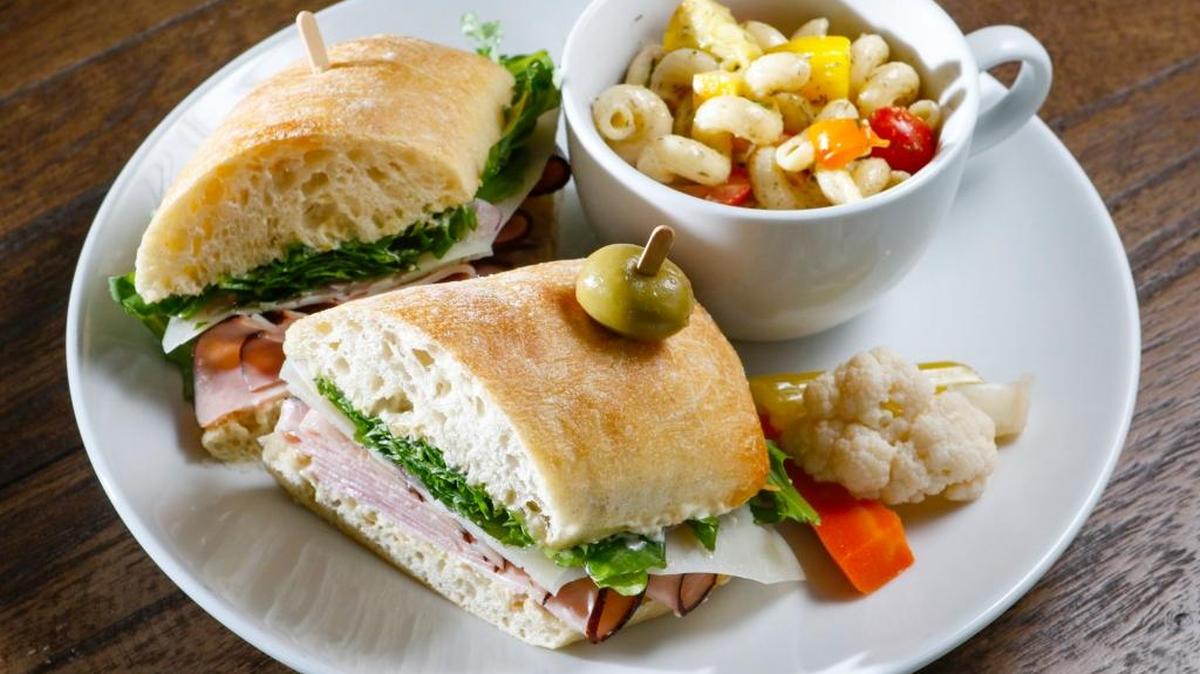 The Dougie sandwich at Ancient Peaks Café in Santa Margarita features, ham, manchego cheese, arugula, red onion, muffuletta and rémoulade.