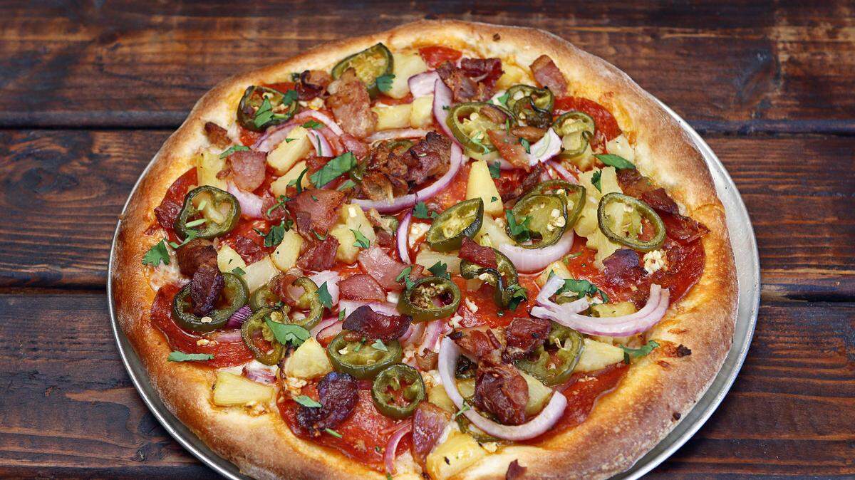 The Michaela pizza at Palo Mesa Pizza, which has locations in Arroyo Grande and San Luis Obispo, features pepperoni, red onion, pineapple, applewood-smoked bacon and cilantro.