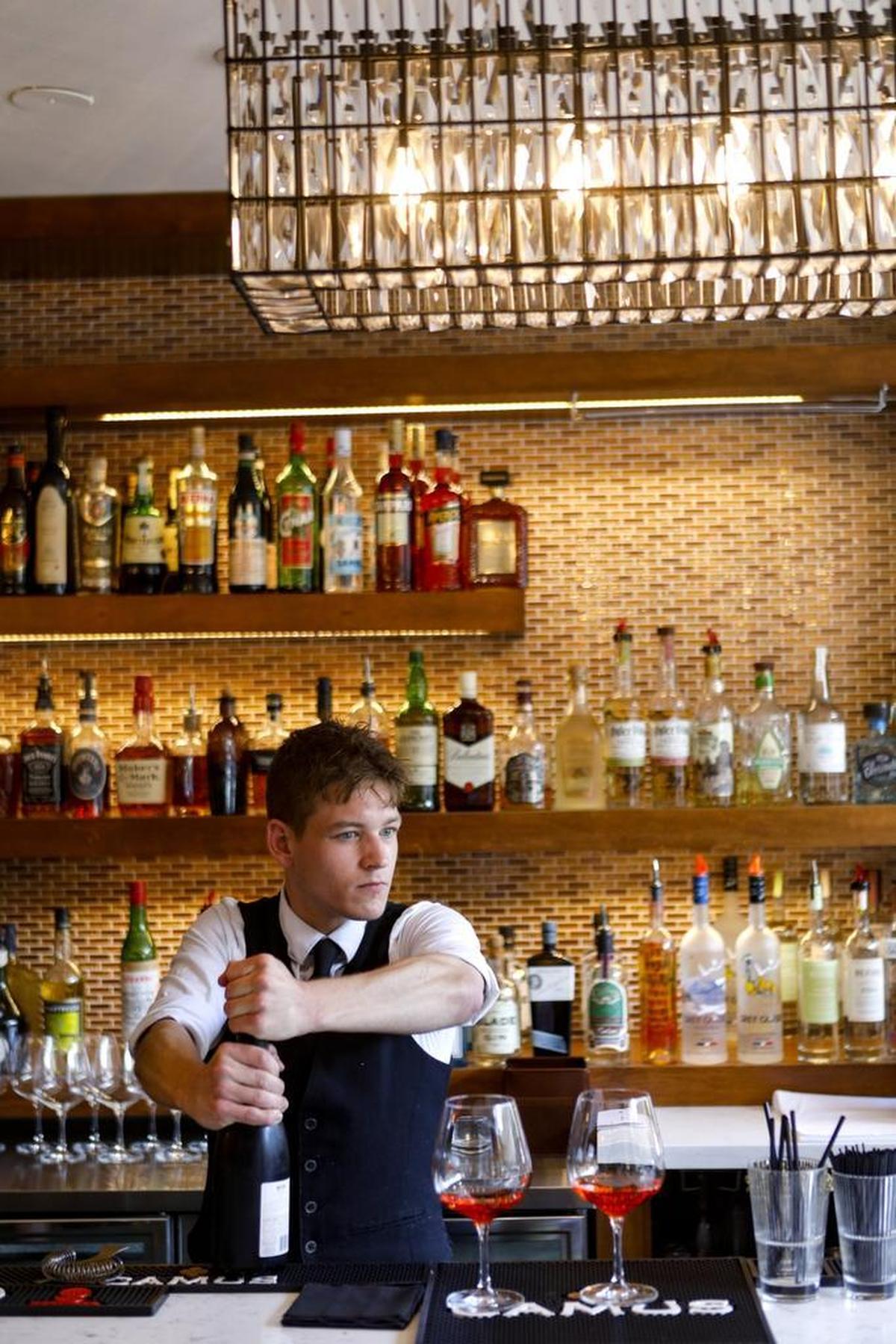 Bartender Jake Brosseau makes an Aperol spritz at Flour House in San Luis Obispo.