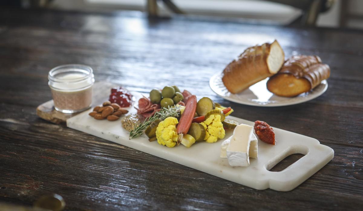 The Wolf Platter at Barton Kitchen Window at Barton Family Wines in Paso Robles comes with artisan cheese, house pickles, salumi, whole-grain mustard, chicken liver mousse and tomato and persimmon jams, plus a toasted baguette.