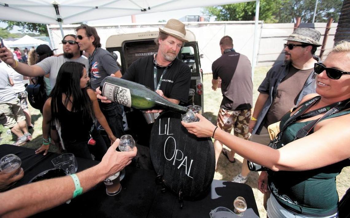 Firestone Walker Brewing Co. barrelmeister Jeffers Richardson pours a large bottle of wild ale Feral One at the Firestone Walker Invitational Beer Fest at the Paso Robles Event Center in 2014. The festival returns in June 2018.